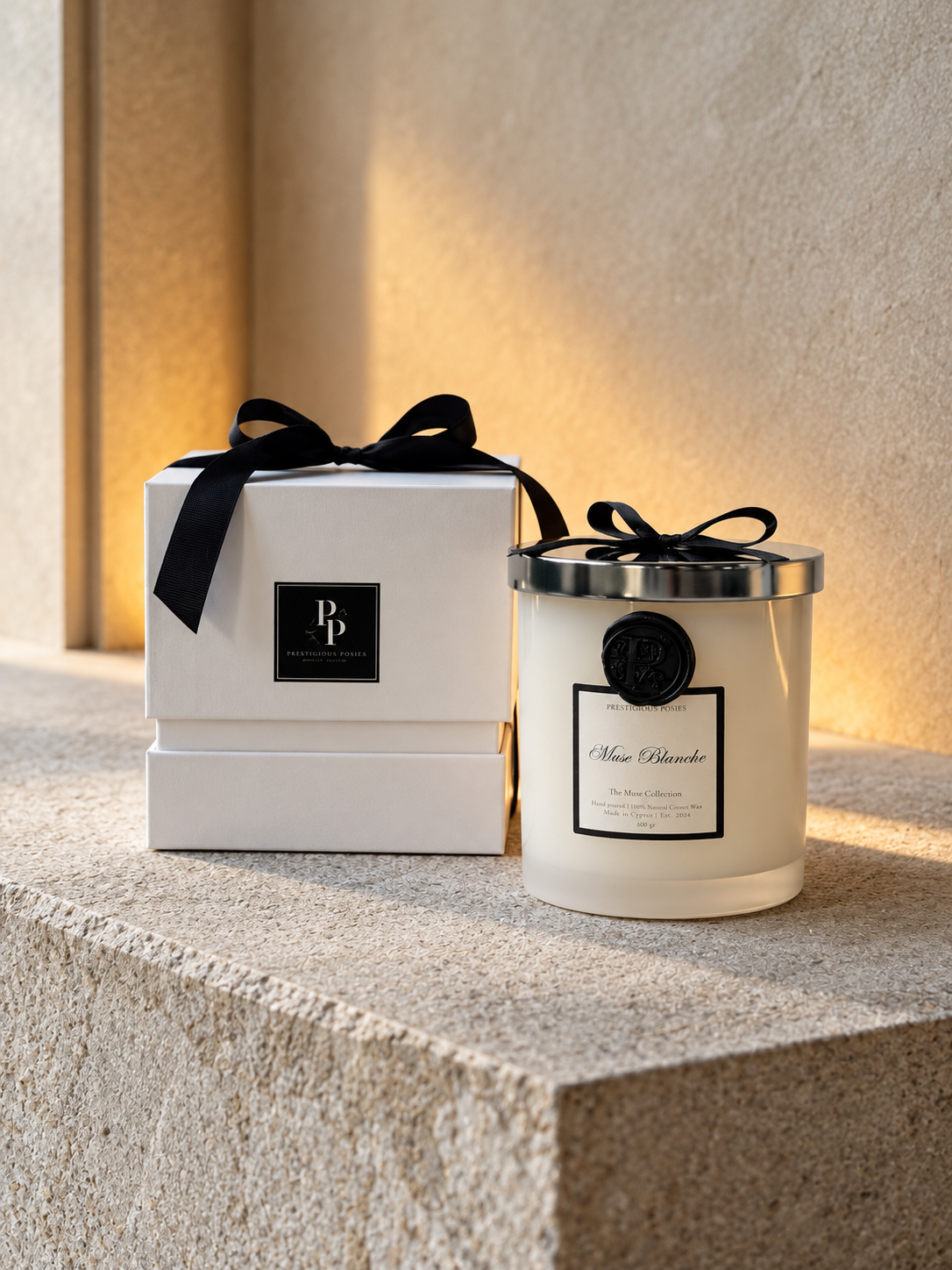 La Neige, a white frosted glass jar candle with a silver lid, by Prestigious Posies