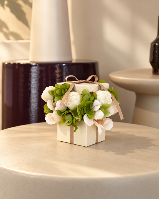 Elysian Mini Square Bouquet, a bouquet of eight handcrafted olive wax flower candles in a square box